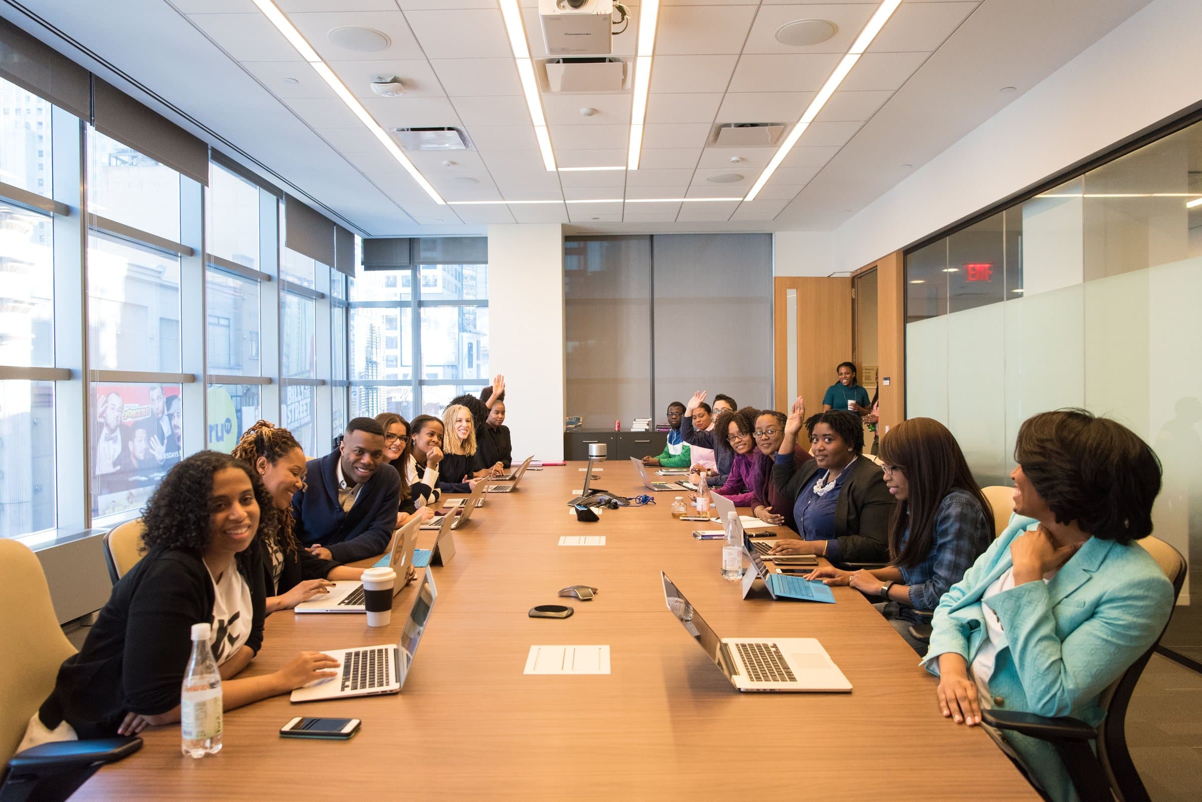 Professionals gathered around a boardroom table